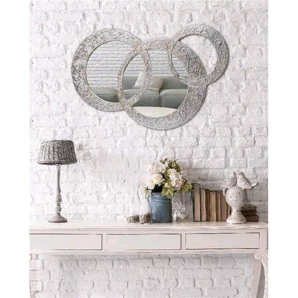 Specchiera Piccola Circles Pintdecor con forma rotonda e design moderno, perfetta per decorare pareti eleganti.