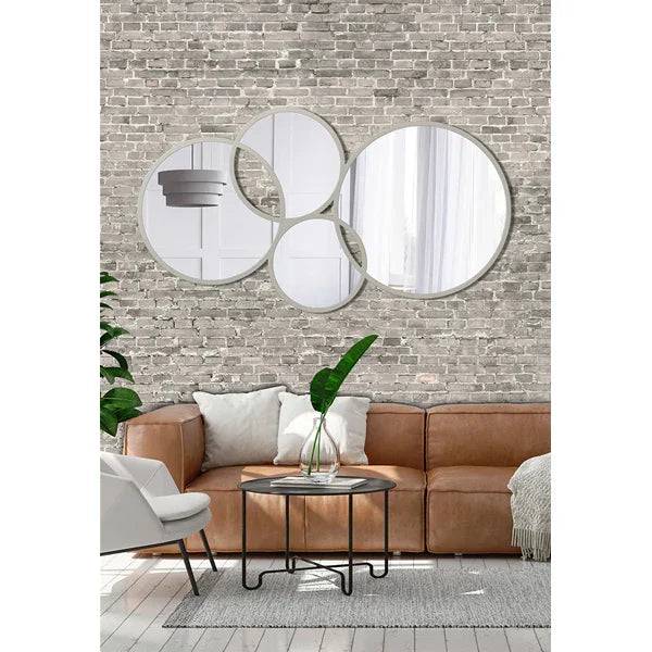 Specchiera Eclissi Pintdecor in tonalità tortora con design moderno e raffinato, riflessi eleganti e finitura liscia.